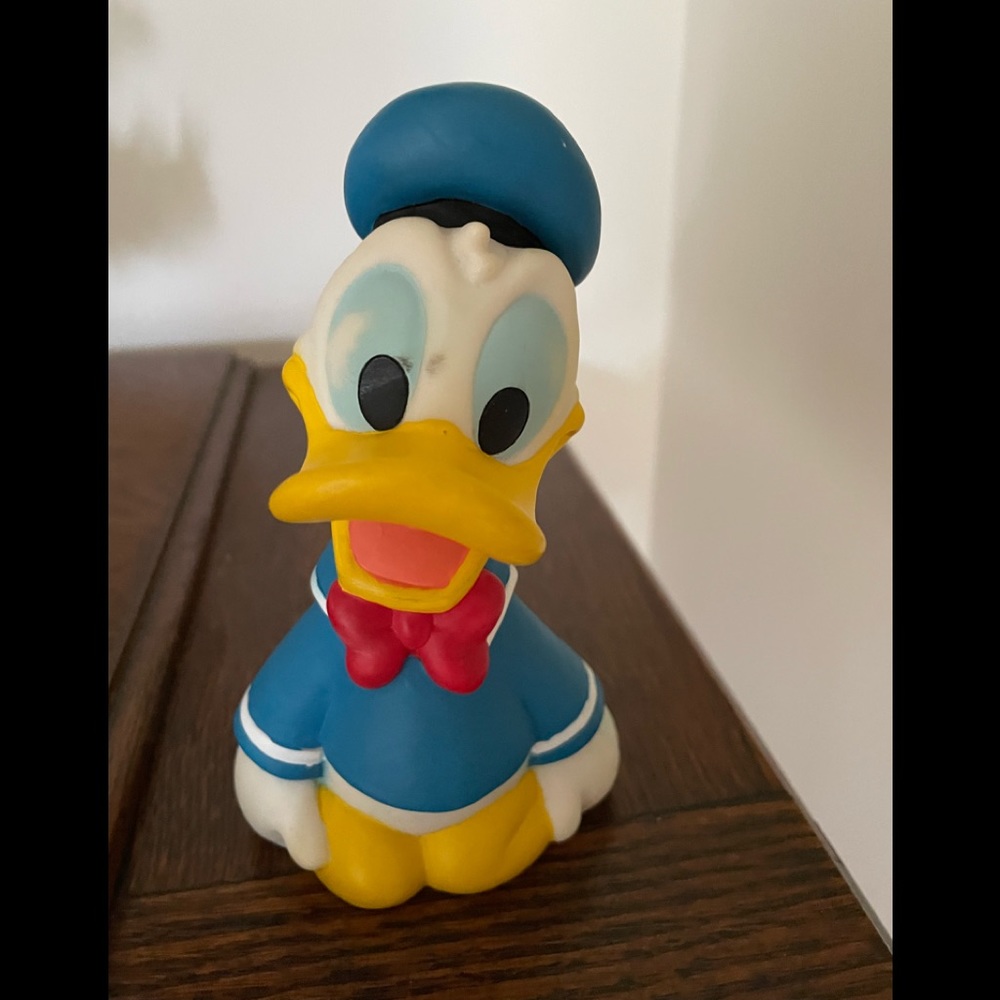 Disney Donald Duck kneeling vinyl bank.